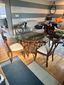 Glass top dining table w/ 4 upholstered matching chairs