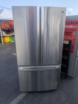 Kenmore elite French door refrigerator/3 months of warranty and free local delivery