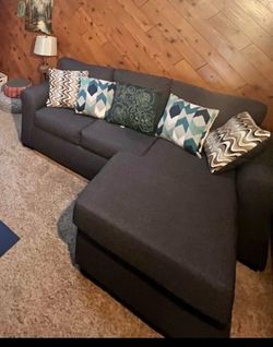 Grey sofa with pull out bed