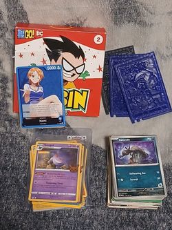 Mixed Card and Sticker Lot Including Pokemon, Yugioh, One Piece, Sports, and More