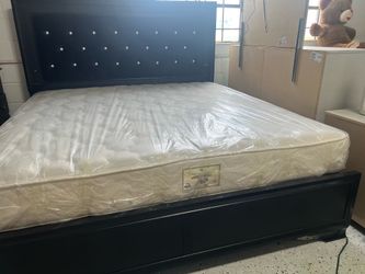 Like new king size mattress and box spring and bed frame