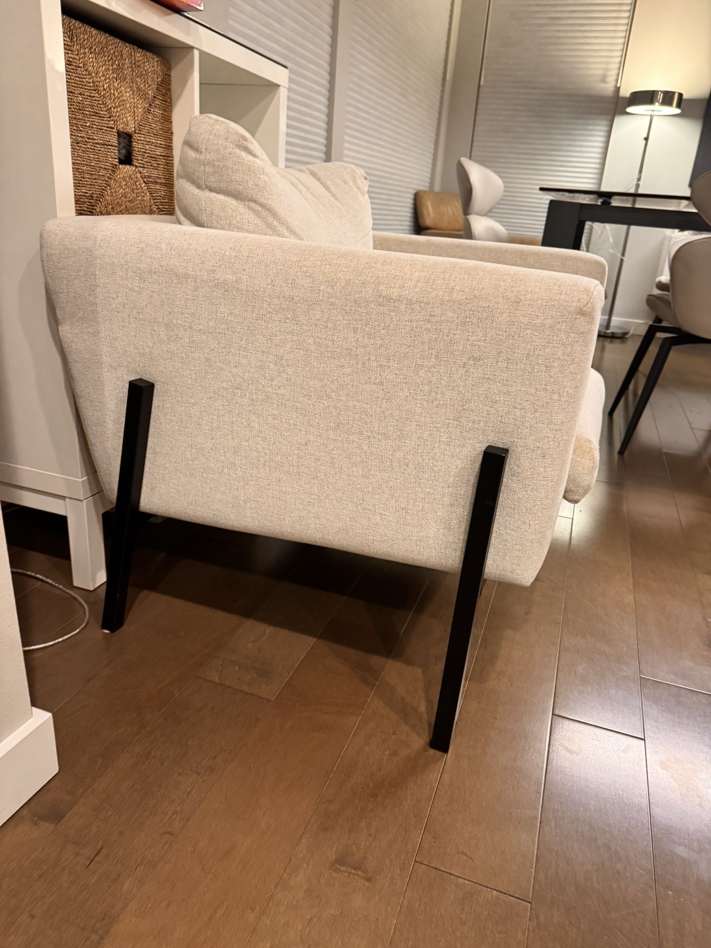 Two IKEA armchairs in a neutral light beige fabric—perfect for living rooms, offices, or reading corners. These chairs are sturdy, comfortable
