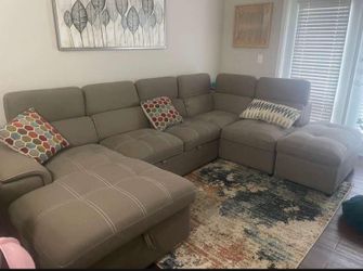 SECTIONAL SOFA WITH COMPARTMENTS AND SOFA BED AND OTTOMAN ORGINAL $2800 only $1,350 OBO like new in excellent condition ILL THROW IN THE CARPET AND PA