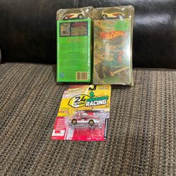 Two Vintage Hot Wheels With Vhs Hot Wheels Movie. And One Johnny Lightning.