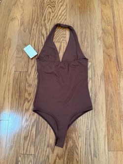 chocolate-brown Halter-style bodysuit with a sleek, fitted silhouette.Size-S