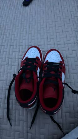 Nike Air Jordan 1 Low sneakers in a red, white, and black size 7