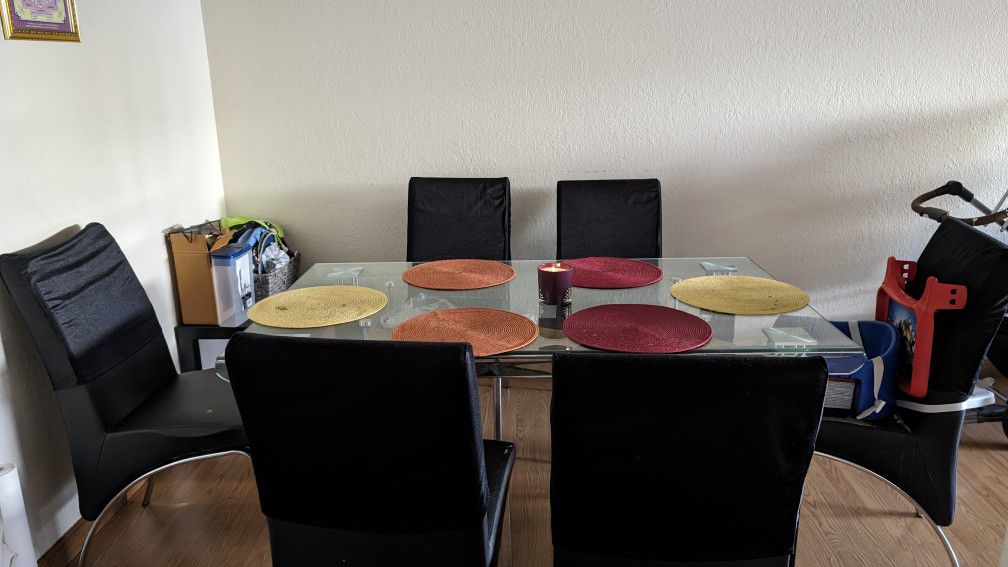Sleek glass dining table with storage, plus  free chairs!