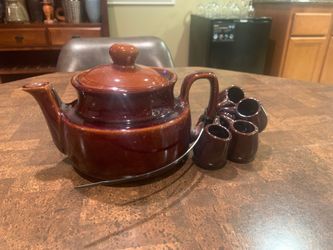 Ceramic tea pot and small cups