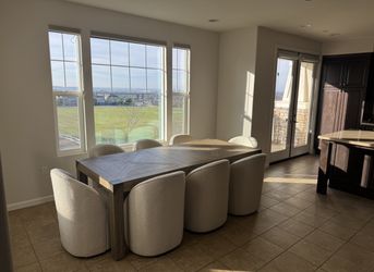 Living Spaces 9-Piece Dining Set – Extendable Table + 8 Boucle Chairs – $1,500