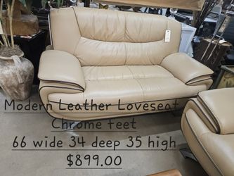 Loveseat leather w/ Chrome feetWe are located at 2811 East Bell road. Another Time Around Furniture.