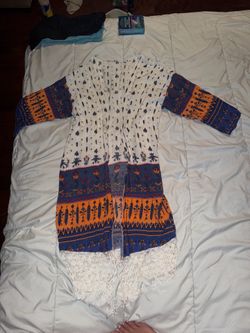 White Boho Fringe kimono with Blue and Orange Print OS no tag or brand. Some strings on bottom are stretched out & longer than others