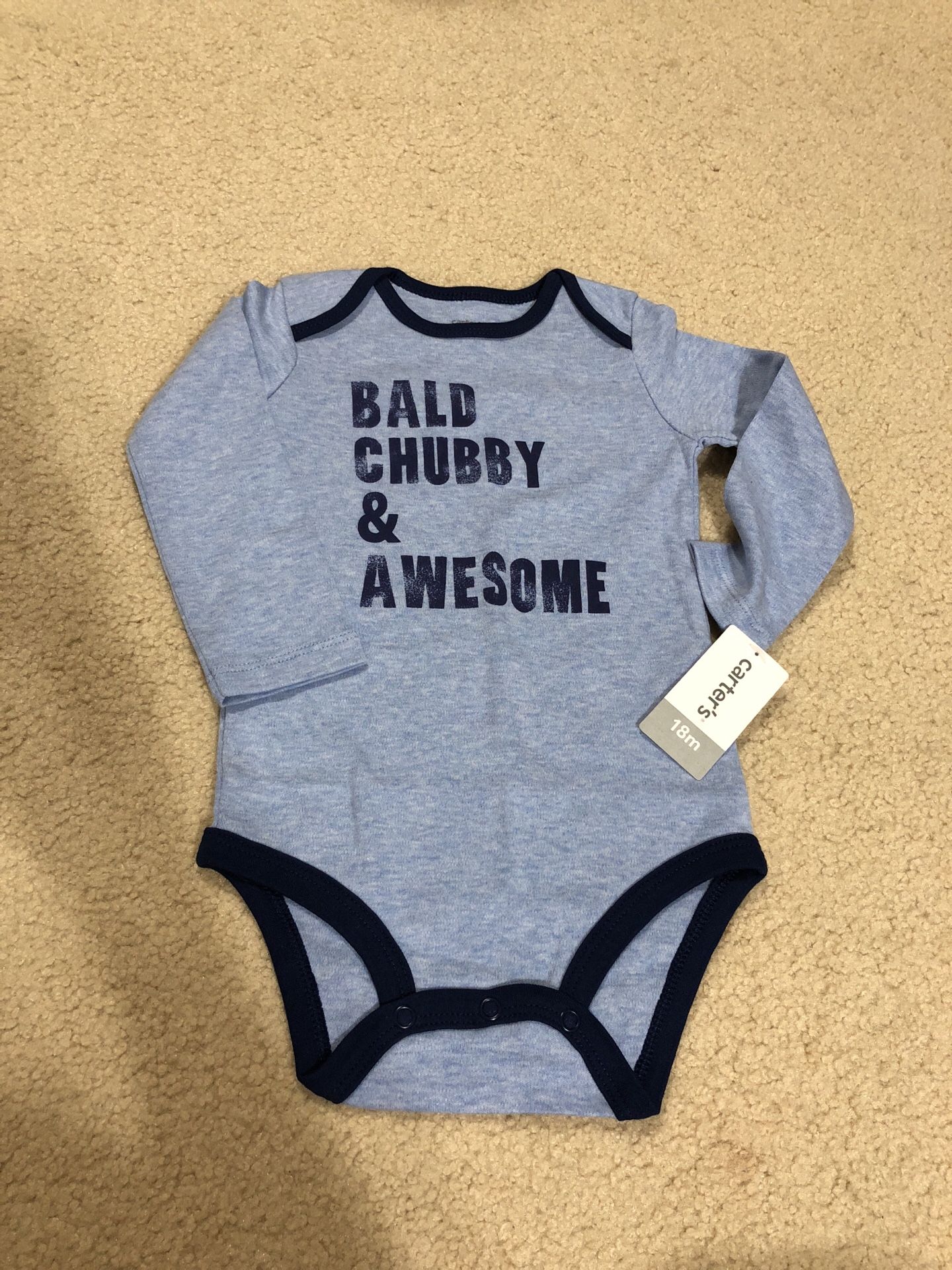 BRAND NEW: Carter’s onesie size 18 Months