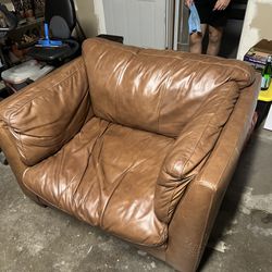 Brown leather single couch