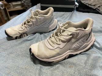 Under Armour white athletic shoes (camo bottom)