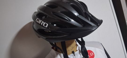 Black Giro cyclist helmet size medium like new.