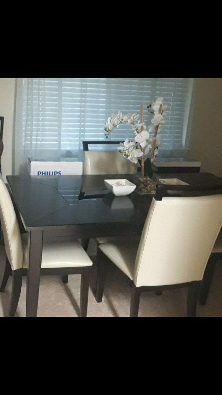 Dark brown dining table with 4 beautiful matching chairs.