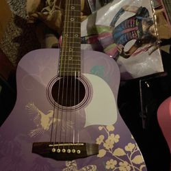 2 guitars, purple Hannah Montana, pink Daisy rock