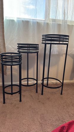 3 black plant stands