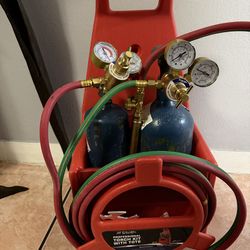 Tanque de oxígeno y acetileno y mangueras de mani for