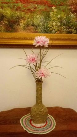 Tall vase flower arrangement.