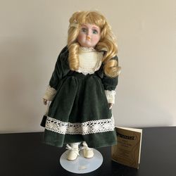 Seymour Mann Connoisseur Porcelain Doll Brigitte 1990s. Approximately 14” tall. Used for display only, in beautiful condition with minimal signs of us