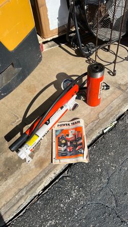 Powerteam hydraulic hand pump and 20 ton jack.