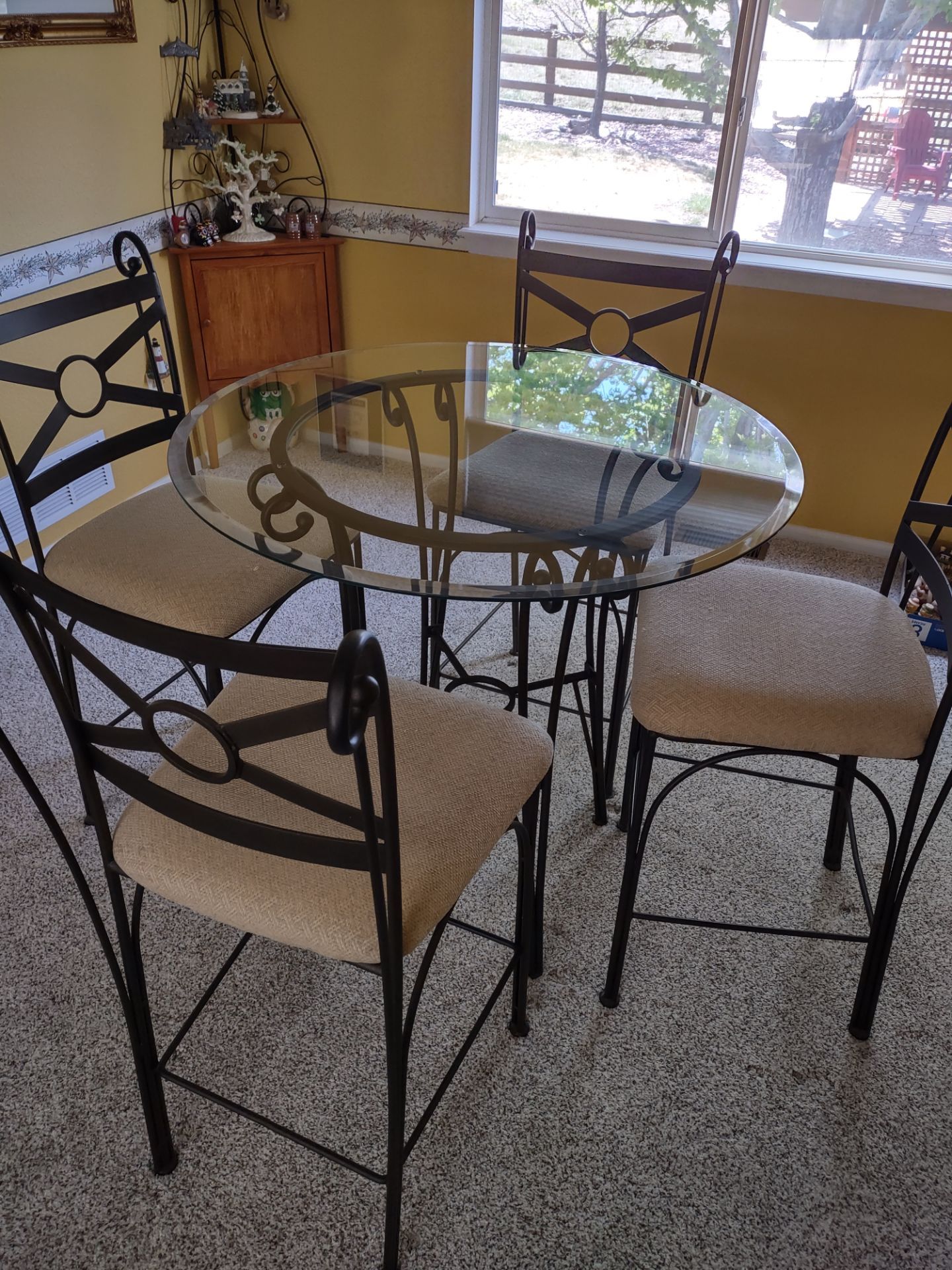 Round glass counter height table & 4 padded chairs