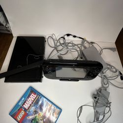 Nintendo Wii U console with game, cords, and camera