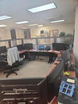 Desks and partitions configurable work stations for up to 6 people