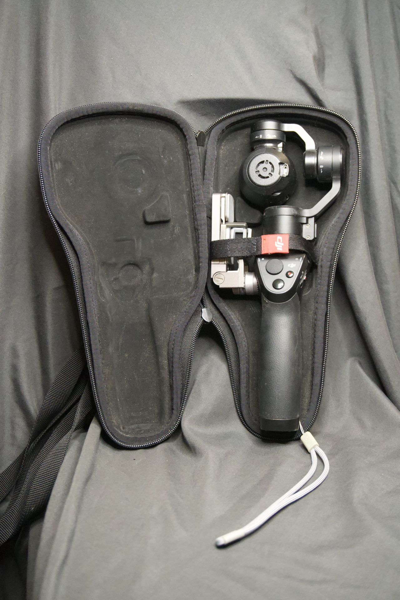 DJI Osmo Handheld 4K Camera & 3-Axis Gimbal – Used (No Charger, Case Damaged)