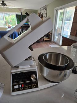 Kitchen center with stand mixer, food processor, and blender.