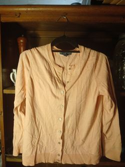 This is a Karen Scott peach v-neck cardigan.
