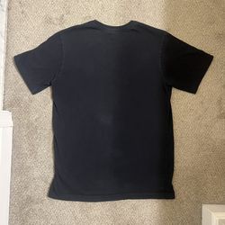 black shirt with white and red font 