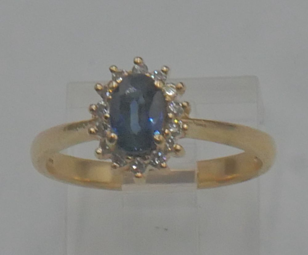 14kt yellow gold ring 2.8 grams ; 14 diamonds 0.14 total ;oval sapphire size 6.5. 889792-4. 