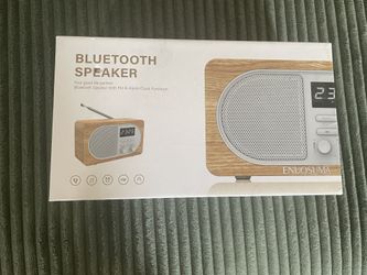 Alarm clock with speaker