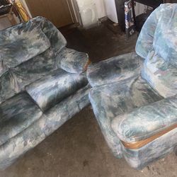 2 sofas one is a recliner 