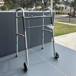 Drive Medical Deluxe 2 Button Folding Walker With 5 Inch Wheels.