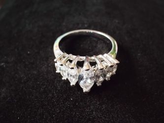 Princess crown cubic zirconia band size 6 silver plated seven marquise-cut stones in graduated sizes, band shines and looks brand new.
