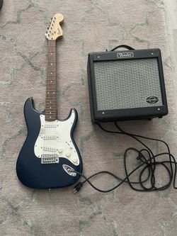 Fender Electric Guitar And Speaker