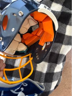Schutt xl football pads grey and black and schutt helmeny blue and orange