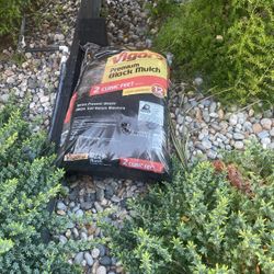 Two Bags Of Black Mulch 