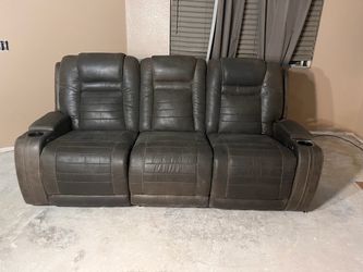 Three seat sofa with power reclining end seats. Will throw in a counter height table and chairs