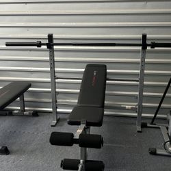 New olympic bench press with leg developer and 7ft olympic bar. New in box $160