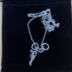 New Gun And Handcuffed Necklace….beautiful 