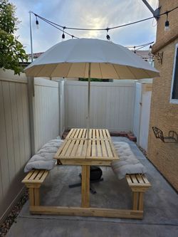 Outdoor table with umbrella