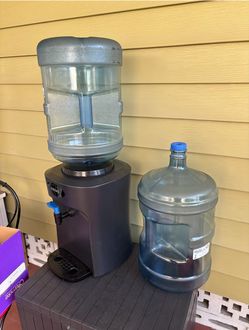 Water Dispenser and Two Five Gallon Bottles