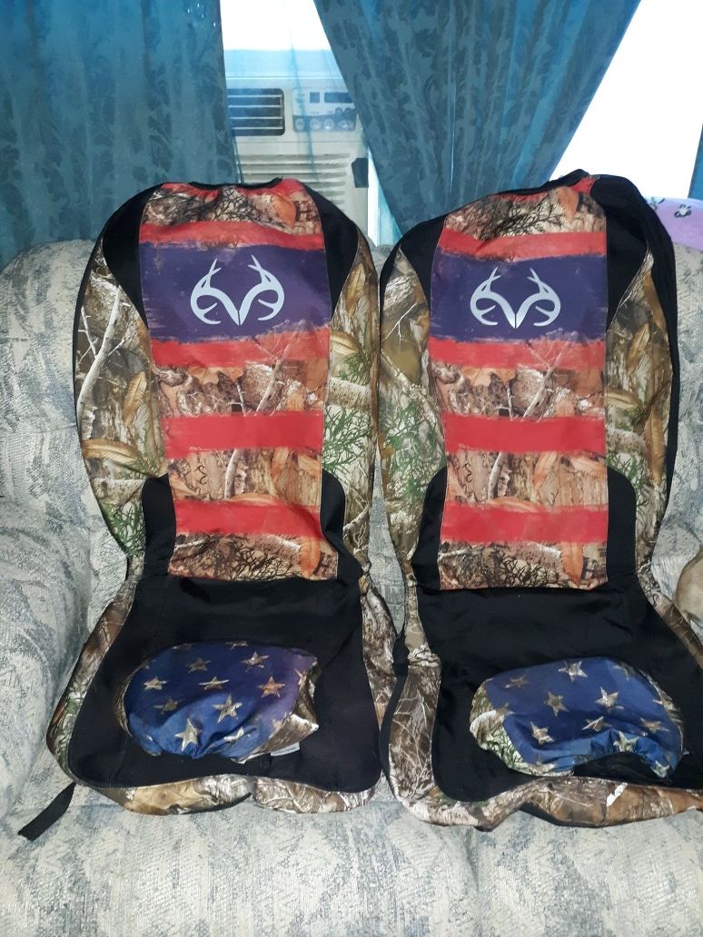 LIKE NEW SEAT COVERS WITH MATCHING HEAD REST COVER AND STEERING WHEEL COVER