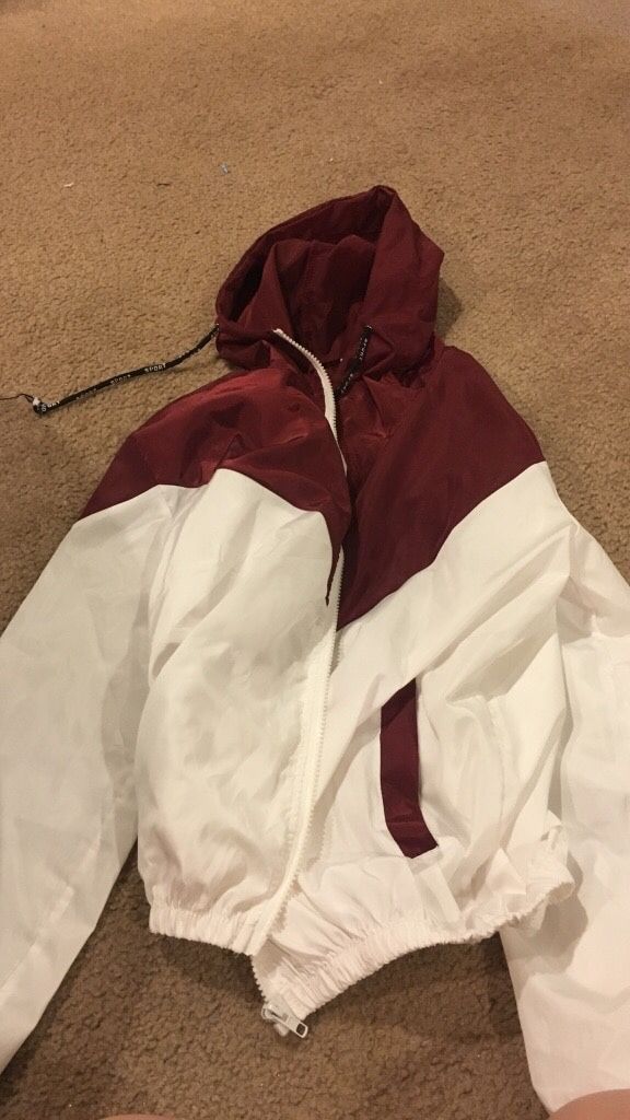 Large maroon and white sports windbreaker