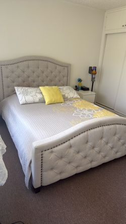 Queen upholstered bed with mattress