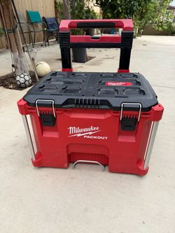 Milwaukee pack out rolling tool box asking $130 thanks
